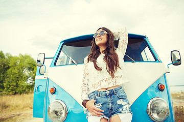 Image showing smiling young hippie woman in minivan car