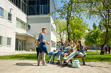 Image showing teenage students with tablet pc at school yard