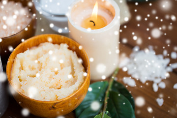 Image showing natural body scrub and candle on wood