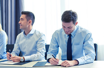 Image showing group of smiling businesspeople meeting in office