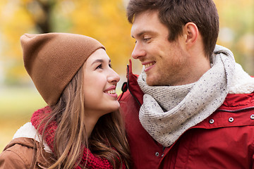 Image showing close up of happy couple walking in autumn park