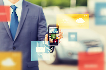 Image showing close up of business man with smartphone media