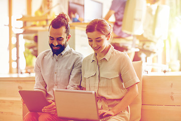 Image showing creative team with tablet pc and laptop in office