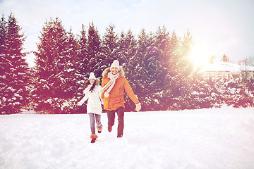 Image showing happy couple running in winter snow
