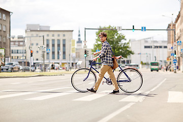 Image showing young man with fixed gear bicycle on crosswalk