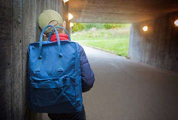 Image showing School child walking in a dark subway