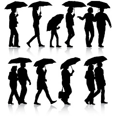 Image showing Black silhouettes man and woman under umbrella. 