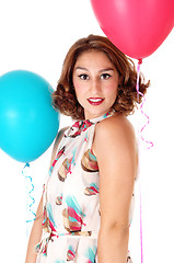 Image showing Young woman with two balloons.