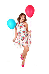 Image showing Lovely dancing woman with balloons.