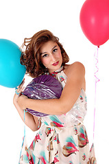 Image showing Beautiful woman holding balloons.