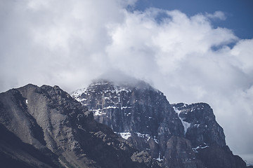 Image showing Clouds hanging over mountains