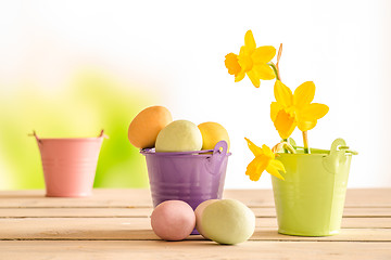 Image showing Easter eggs in a purple bucket