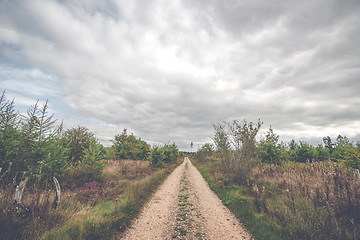 Image showing Dark clouds over a countryside trail