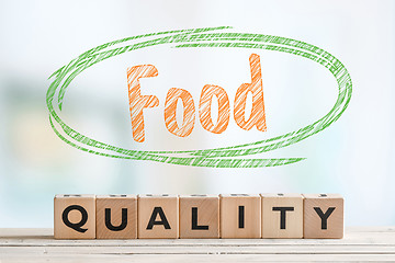 Image showing Food quality sign made of wooden cubes