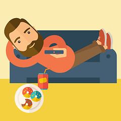 Image showing Man lying in the sofa holding a remote.