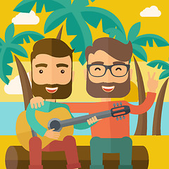 Image showing Two men playing a guitar at the beach