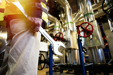 Image showing industrial worker with spanner at factory workshop