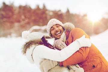 Image showing happy couple hugging and laughing in winter