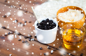 Image showing coffee scrub in cup and honey on wood