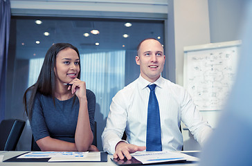 Image showing smiling business people meeting in office