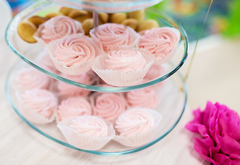 Image showing close up of custard sweets on glass serving tray