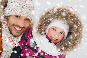 Image showing happy family in winter clothes outdoors