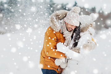 Image showing happy couple hugging and laughing in winter