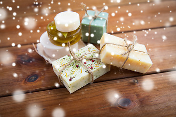 Image showing handmade soap bars on wood