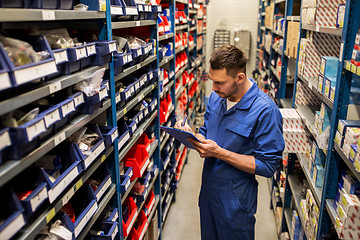 Image showing auto mechanic or smith with tablet pc at workshop