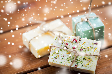 Image showing handmade soap bars on wood