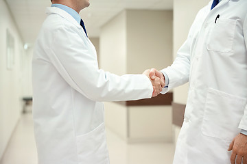 Image showing close up of doctors making handshake