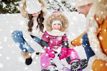 Image showing happy family with sled walking in winter outdoors