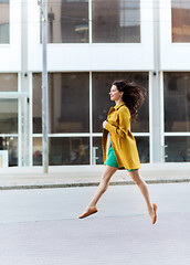 Image showing happy young woman or teenage girl on city street