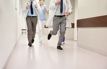 Image showing close up of medics or doctors running at hospital