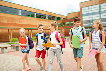 Image showing group of happy elementary school students walking