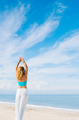 Image showing portrait of young pretty woman looking to the ocean 