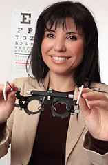 Image showing Optometrist holding trial frames