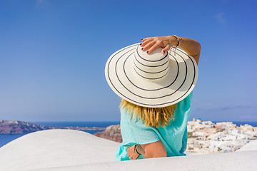 Image showing Young woman on holidays, Santorini Oia town 