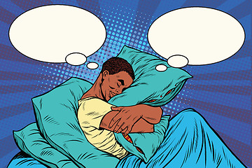 Image showing Dreamer man in bed hugging a pillow