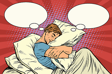 Image showing Dreamer man in bed hugging a pillow