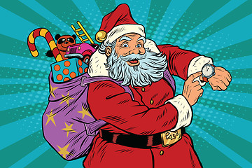 Image showing Santa Claus shows on the clock, New year and Christmas