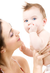 Image showing blue-eyed baby in mother hands