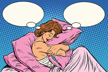 Image showing Young woman in bed hugging a pillow