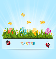 Image showing Greeting card with Easter colorful eggs and camomiles in green g