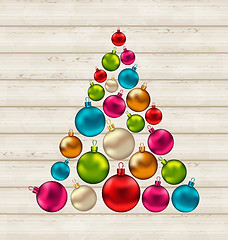 Image showing Christmas tree made of colorful balls on wooden background 