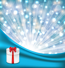 Image showing Gift box with red bow on glowing background