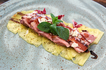 Image showing Pork tenderloin with pineapple