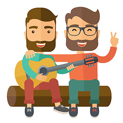Image showing Two men playing a guitar.