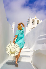 Image showing Young woman on holidays, Santorini Oia town 