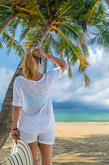 Image showing portrait of young pretty woman looking to the ocean 